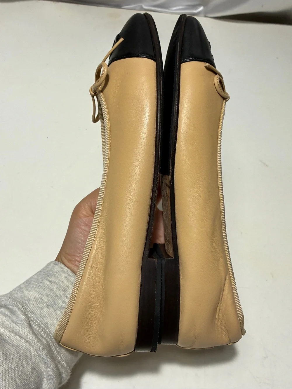 CHANEL Beige Leather Ballet Flats with Black Cap Toe and CC Logo